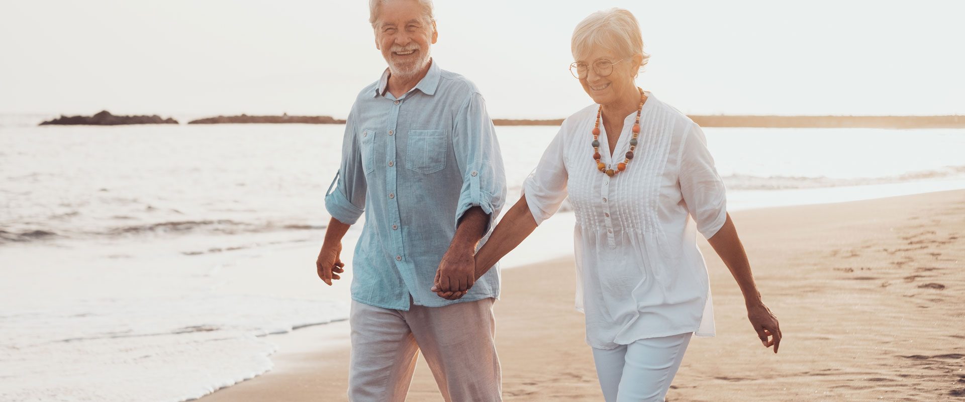 couple-old-mature-people-walking-sand-together-having-fun-sand-beach-enjoying-living-moment-two-cute-seniors-love-having-fun-barefoot-walking-waterxa