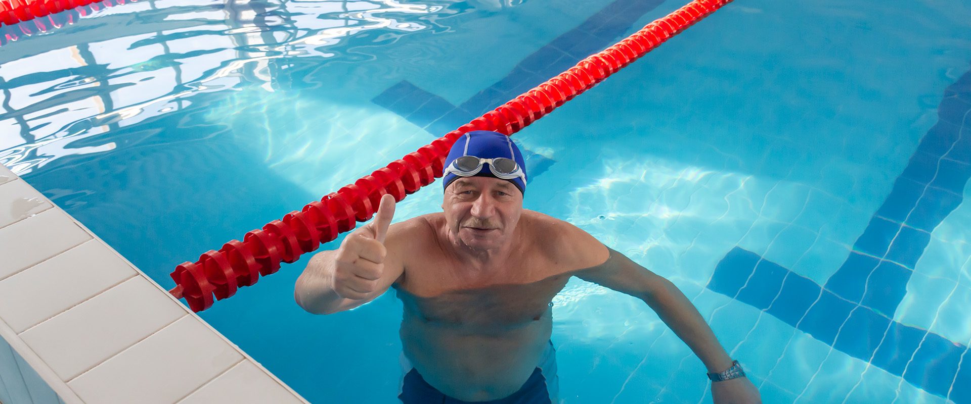happy-elderly-man-stands-pool-clean-water-fresh-air-vacation