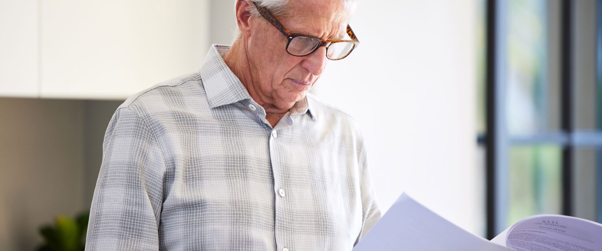 i-see-few-details-i-want-change-shot-mature-man-reading-paperwork
