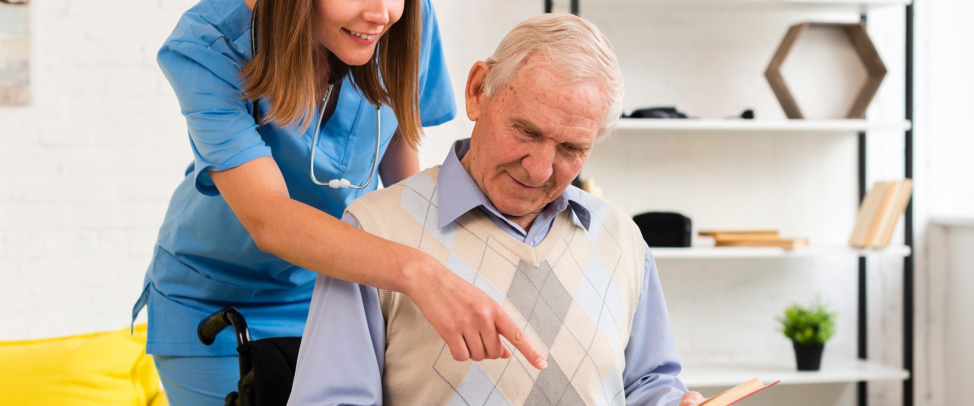 nurse-pointing-old-man-s-book