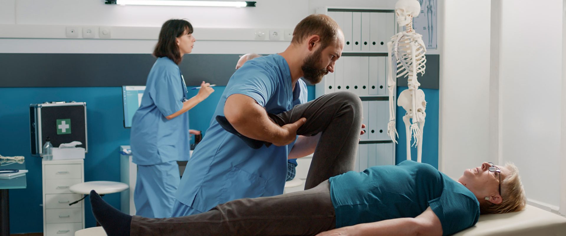 physician-doing-legs-raise-exercise-stretch-legs-old-patient-with-mechanical-disorders-rehabilitation-cabinet-osteopathy-specialist-doing-physical-therapy-procedure-cure-woman
