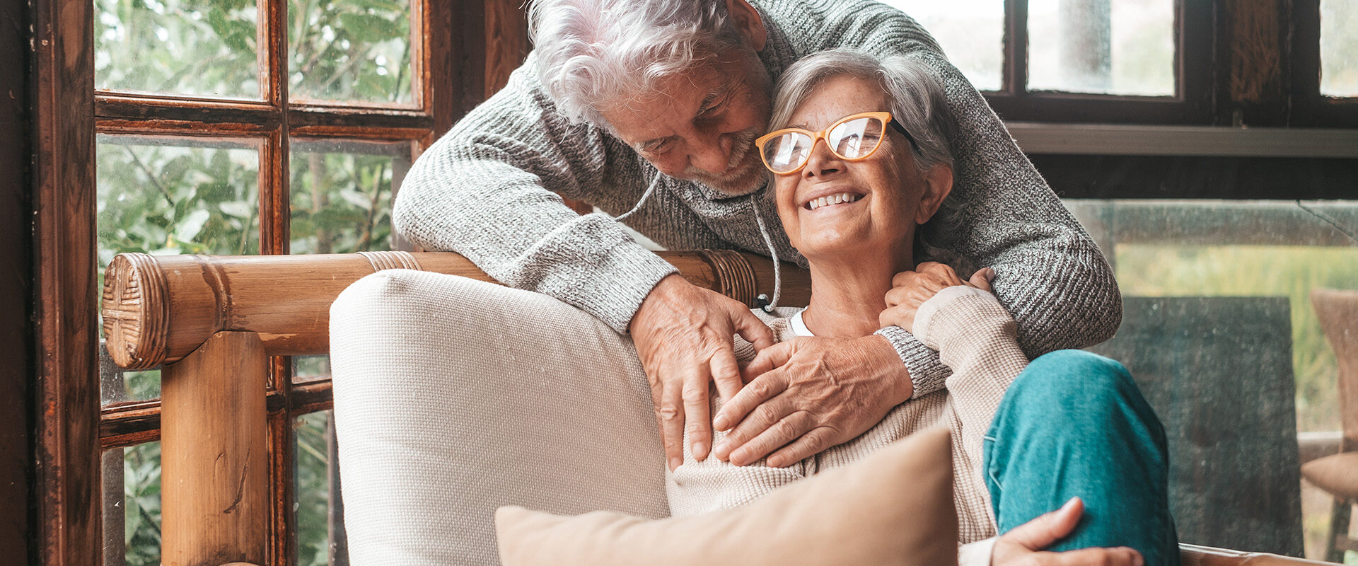 portrait-couple-happy-mature-people-love-hugging-looking-camera-smiling-having-fun-home-two-cute-seniors-enjoying-indoors-together