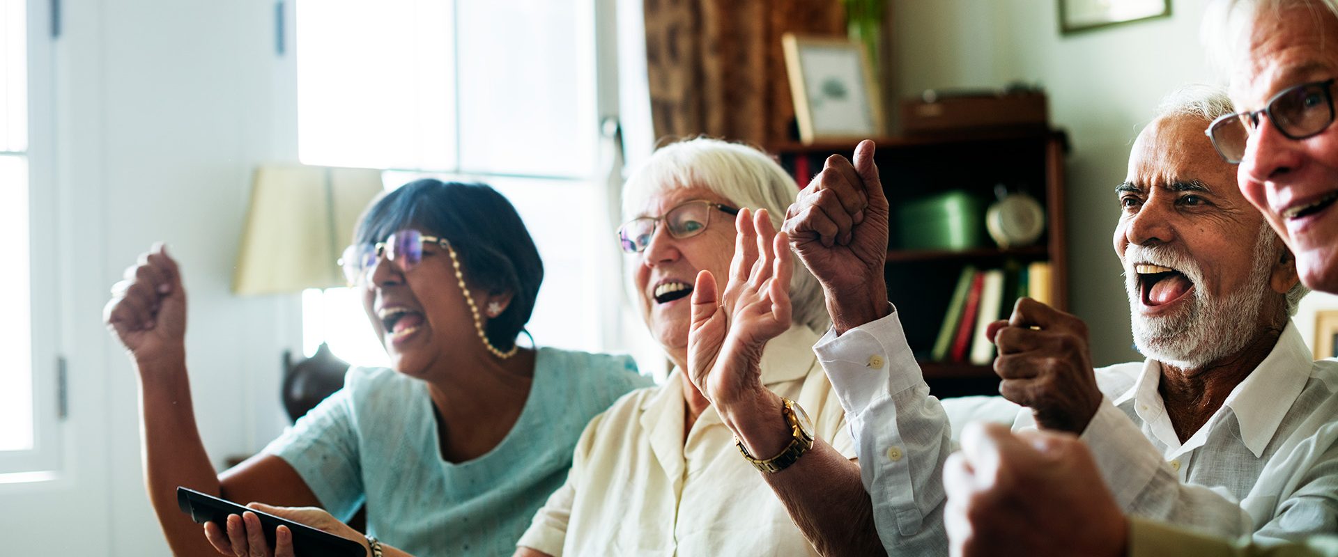senior-people-watching-televison-together