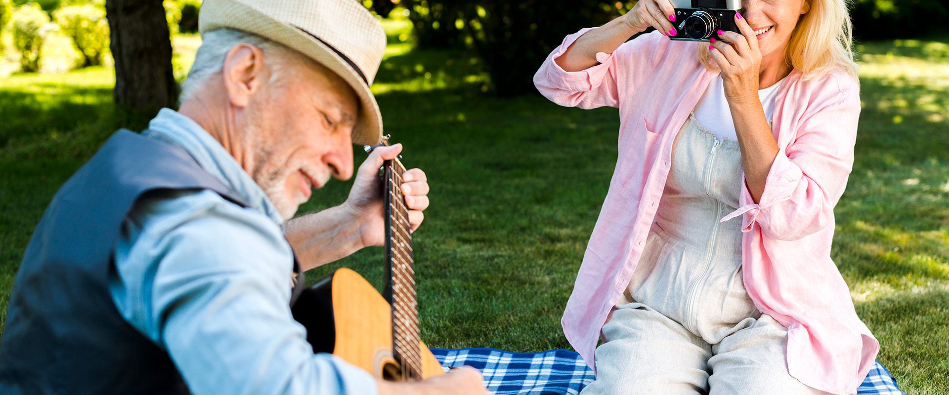 smiley-woman-taking-photo-man-with-guitar