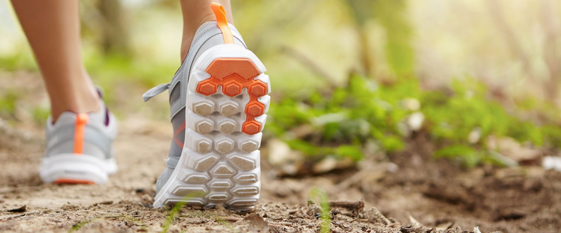 sports-fitness-nature-healthy-lifestyle-concept-young-female-runner-wearing-sneakers-running-shoes-while-hiking-jogging-park-sunny-day