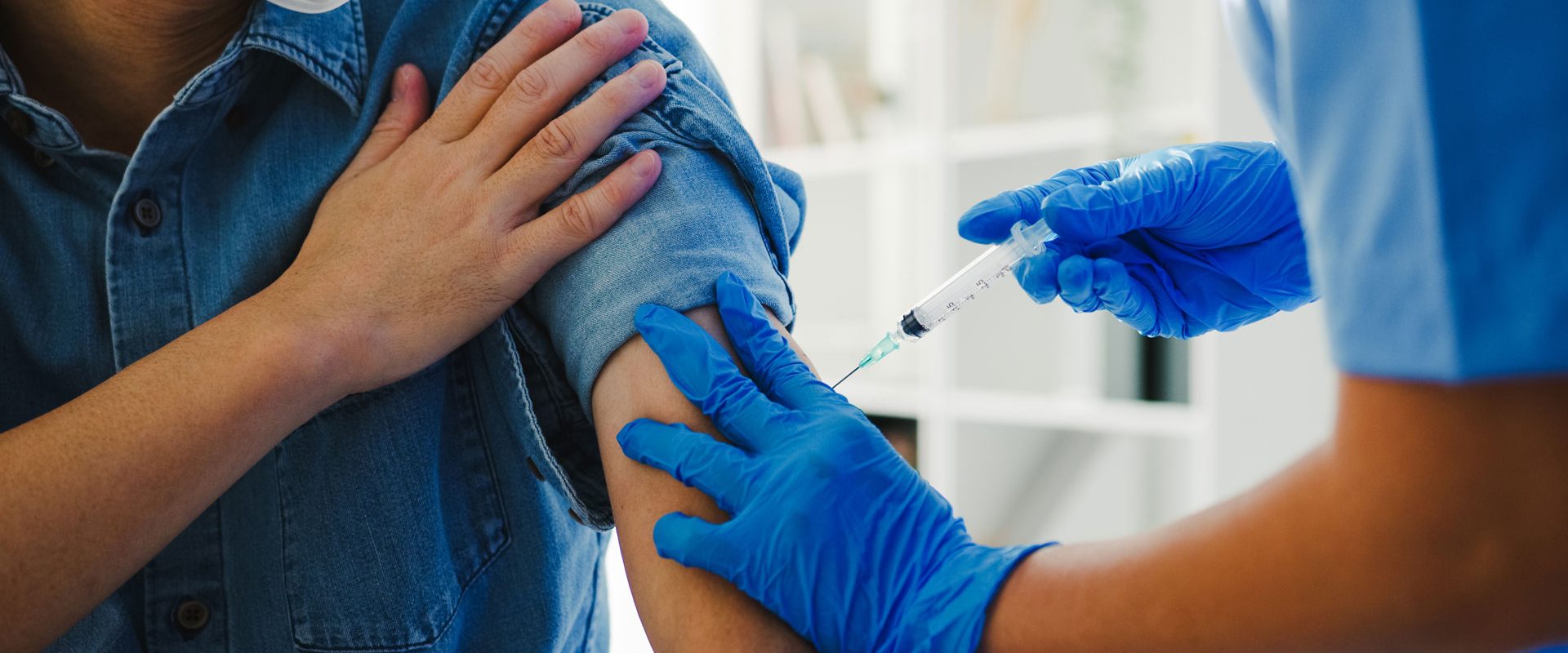 young-asian-lady-nurse-giving-covid-19-flu-antivirus-vaccine-shot-senior-male-patient